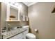 Bathroom featuring a toilet and vanity with a clear glass vessel sink at 15009 S 47Th St, Phoenix, AZ 85044