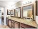 Bathroom featuring a granite countertop and clear glass vessel sinks at 15009 S 47Th St, Phoenix, AZ 85044