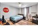 A small bedroom with wood floors, gray walls, and minimal decor at 15009 S 47Th St, Phoenix, AZ 85044