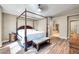 Bedroom features a four poster bed frame, wood floors, and neutral colored walls at 15009 S 47Th St, Phoenix, AZ 85044