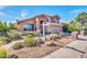 Charming two-story home features a landscaped yard, stone accents, and a spacious garage at 15009 S 47Th St, Phoenix, AZ 85044