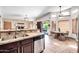 Gourmet kitchen features stainless appliances, granite counters, and breakfast nook dining at 15009 S 47Th St, Phoenix, AZ 85044