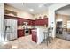 Modern kitchen with stainless steel appliances, granite countertops, and bar seating at 15009 S 47Th St, Phoenix, AZ 85044