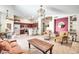 Open-concept living space with tile flooring, modern lighting, and an inviting seating area at 15009 S 47Th St, Phoenix, AZ 85044