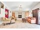 Inviting living room with a fireplace, comfortable seating, and ample natural light at 15009 S 47Th St, Phoenix, AZ 85044