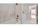 Stylish bathroom featuring a tub, shower, and laundry appliances at 1550 N Stapley Dr # 21, Mesa, AZ 85203