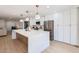 Bright kitchen features a large island, stainless steel appliances, and ample cabinet space at 1550 N Stapley Dr # 21, Mesa, AZ 85203