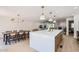 Open concept kitchen with a large island, dining table and view into the living room at 1550 N Stapley Dr # 21, Mesa, AZ 85203