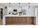 Beautiful kitchen with large island, pendant lights, stainless steel appliances and stone countertops at 1550 N Stapley Dr # 21, Mesa, AZ 85203