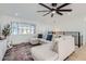 Cozy living room with a large sectional sofa and a modern ceiling fan at 1550 N Stapley Dr # 21, Mesa, AZ 85203