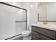 Bathroom featuring a toilet, shower with black trim and sliding door, and a single sink vanity at 1565 E Tiffany Way, Gilbert, AZ 85298