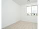 Simple, bright bedroom featuring neutral carpet and a window that offers natural light at 1565 E Tiffany Way, Gilbert, AZ 85298