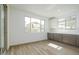 Dining area with hard flooring, large windows, and gray cabinetry at 1565 E Tiffany Way, Gilbert, AZ 85298