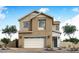 Charming two-story home featuring neutral exterior, two-car garage, and tasteful stone accents at 1565 E Tiffany Way, Gilbert, AZ 85298