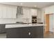 Modern kitchen with white subway tile, stainless steel appliances, and quartz countertops at 1565 E Tiffany Way, Gilbert, AZ 85298