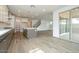 Open floor plan with kitchen, dining, and living area with access to patio at 1565 E Tiffany Way, Gilbert, AZ 85298