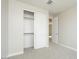 Bedroom with neutral walls, closet with sliding doors, and door leading into the hallway at 1571 E Tiffany Way, Gilbert, AZ 85298