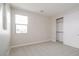 Bright bedroom features a large window for natural light and a spacious closet with sliding doors at 1571 E Tiffany Way, Gilbert, AZ 85298