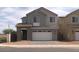 Charming two-story home with a two-car garage and well-maintained landscaping at 1571 E Tiffany Way, Gilbert, AZ 85298