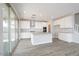 Bright, spacious kitchen with white cabinets, modern appliances, and a center island at 1571 E Tiffany Way, Gilbert, AZ 85298