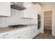 Well-equipped kitchen with built-in stainless appliances and a herringbone backsplash at 1571 E Tiffany Way, Gilbert, AZ 85298