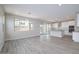 Open-concept living room featuring wood-look tile floors and abundant natural light at 1571 E Tiffany Way, Gilbert, AZ 85298