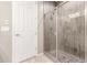 Modern bathroom with a glass-enclosed shower with light gray wood-look tile surround at 1644 E Joelle Dr, Casa Grande, AZ 85122