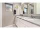 Double sink bathroom vanity with a large mirror and soft gray walls at 1644 E Joelle Dr, Casa Grande, AZ 85122