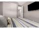Cozy bedroom showcasing plush pillows, adjacent closet, and mounted television at 1644 E Joelle Dr, Casa Grande, AZ 85122