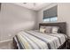 Comfortable bedroom featuring neutral walls, sleek window treatment, and ceiling fan at 1644 E Joelle Dr, Casa Grande, AZ 85122