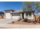 Charming single-story home featuring a three-car garage and desert landscaping at 1644 E Joelle Dr, Casa Grande, AZ 85122
