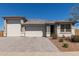 Charming single-story home featuring a three-car garage and desert landscaping at 1644 E Joelle Dr, Casa Grande, AZ 85122