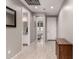 Bright hallway with hardwood floors and views of the bathroom and bedroom at 1644 E Joelle Dr, Casa Grande, AZ 85122