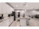 Bright kitchen with stainless appliances, granite counters, and white cabinetry at 1644 E Joelle Dr, Casa Grande, AZ 85122