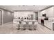 Large kitchen with granite island, sleek white cabinetry, and stainless fridge at 1644 E Joelle Dr, Casa Grande, AZ 85122