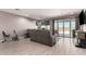 Spacious living room with tile floors, and view of backyard pool and patio at 1644 E Joelle Dr, Casa Grande, AZ 85122