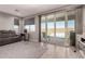 Comfortable living room features tile flooring and large sliding glass doors to the backyard at 1644 E Joelle Dr, Casa Grande, AZ 85122