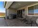 Covered patio with a built-in grill, smoker, and comfortable seating, ideal for outdoor cooking and relaxation at 1644 E Joelle Dr, Casa Grande, AZ 85122