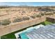 Stunning pool area with a basketball hoop, lounge chairs, and desert views, creating a resort-like experience at 1644 E Joelle Dr, Casa Grande, AZ 85122
