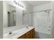 Bathroom featuring a double sink vanity and shower-tub combo at 1650 S Crismon Rd # 6, Mesa, AZ 85209