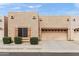Charming townhome featuring a stucco exterior, one-car garage, well-maintained landscaping, and inviting curb appeal at 1650 S Crismon Rd # 6, Mesa, AZ 85209