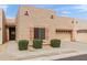 Charming townhome featuring a stucco exterior, one-car garage, well-maintained landscaping, and inviting curb appeal at 1650 S Crismon Rd # 6, Mesa, AZ 85209