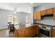 Bright kitchen featuring modern appliances, ample counter space, and a seamless flow into the dining area at 1650 S Crismon Rd # 6, Mesa, AZ 85209