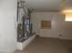 Utility room features two water heaters, cabinets and finished floor at 18001 N Timber Ridge Dr, Surprise, AZ 85374
