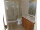The bathroom features a glass-enclosed shower and a wooden vanity at 18001 N Timber Ridge Dr, Surprise, AZ 85374