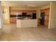 Spacious kitchen features a large island, dark countertops, and wood cabinets at 18001 N Timber Ridge Dr, Surprise, AZ 85374