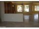 Open-concept living space features tile floors and a built-in bookcase at 18001 N Timber Ridge Dr, Surprise, AZ 85374