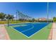 Open air community basketball court with desert landscaping and lighting at 18368 W Long Lake Rd, Goodyear, AZ 85338