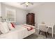 Cozy bedroom with neutral walls, white shuttered windows, and quaint furnishings at 18368 W Long Lake Rd, Goodyear, AZ 85338