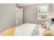 A bedroom with a queen bed and plantation shutters at 18368 W Long Lake Rd, Goodyear, AZ 85338